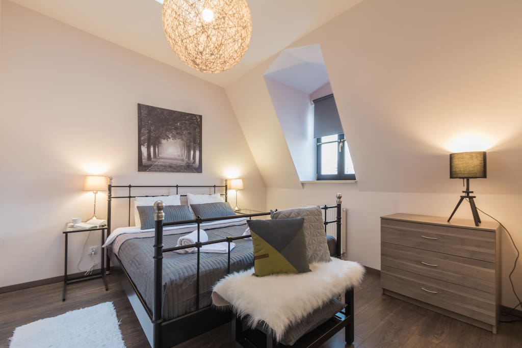 Very cozy bedroom with comfortable double bed.