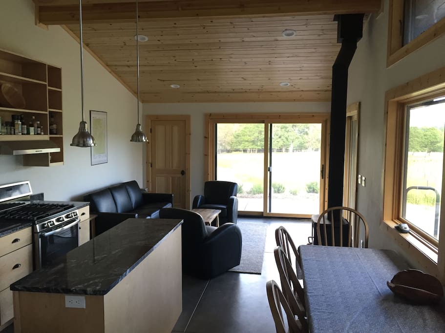 The kitchen and living area with high ceilings and amazing views.