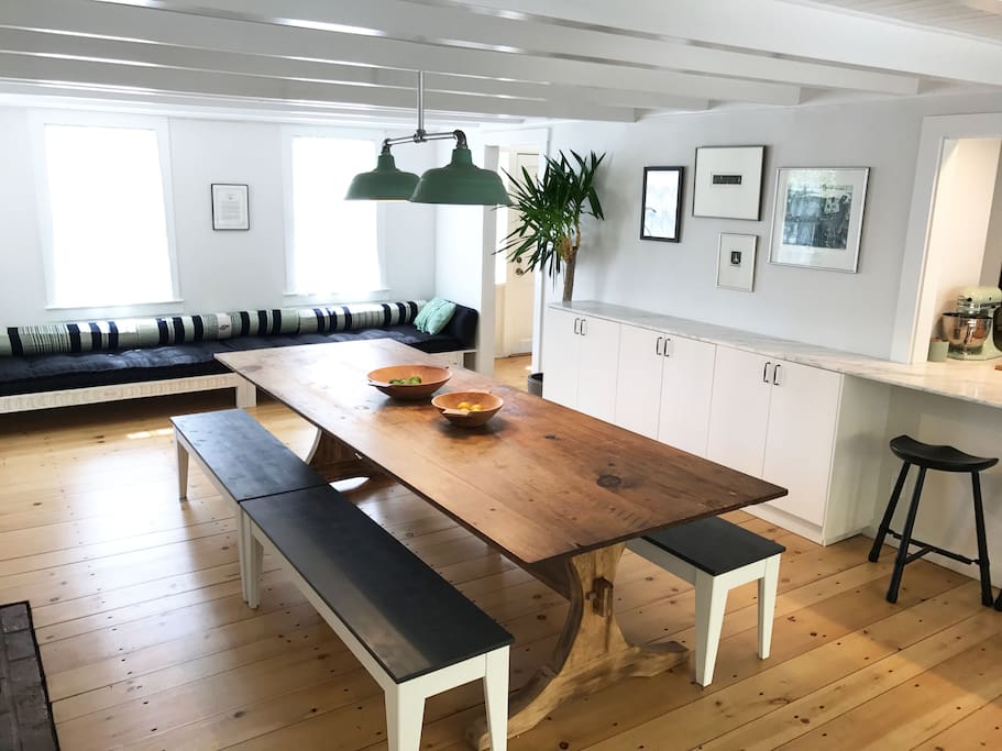 The dining area with an antique farm table that comfortably seats 12. Fireplace off picture to the left.