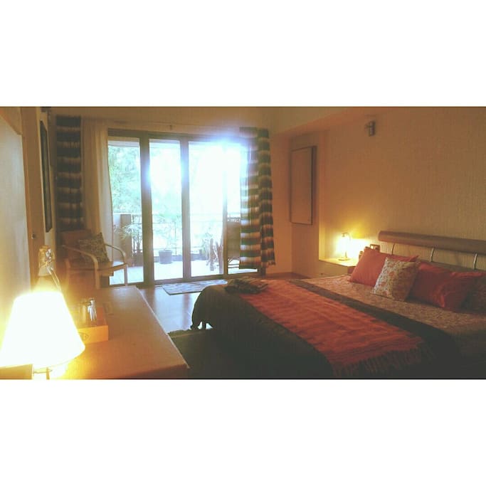 Cozy room with attached balcony and bathroom