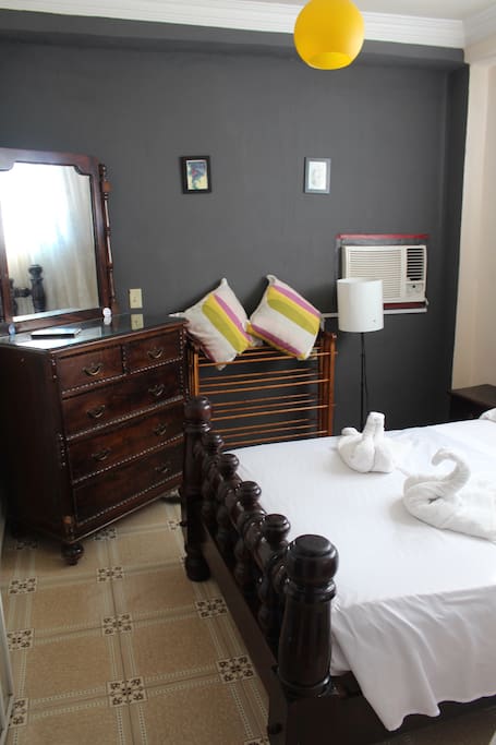 This is your room. The furniture is hand-carved in Santiago by a master carpenter known city-wide for his talents.