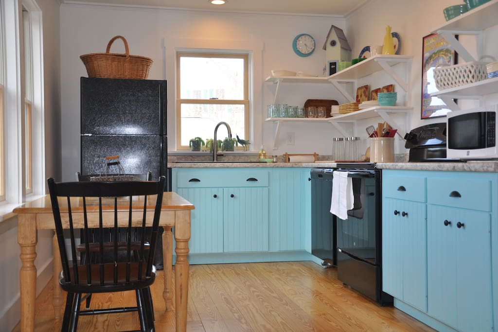 The eat in kitchen has full sized appliances.
