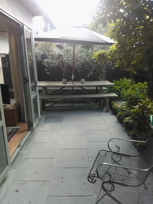 Courtyard - This table has been replaced with a small round one and two chairs.