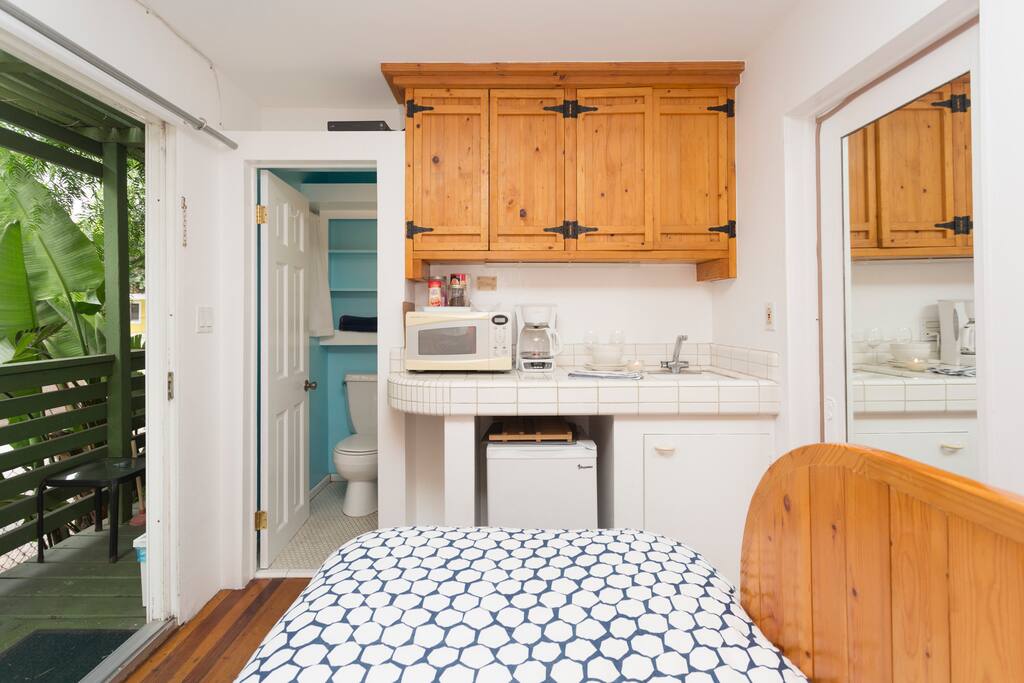 Kitchenette with basic kitchen supplies, coffee, coffee maker, microwave, etc.