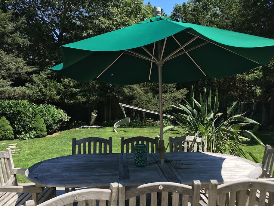 Teak table for 8 overlooks sculpture and gardens