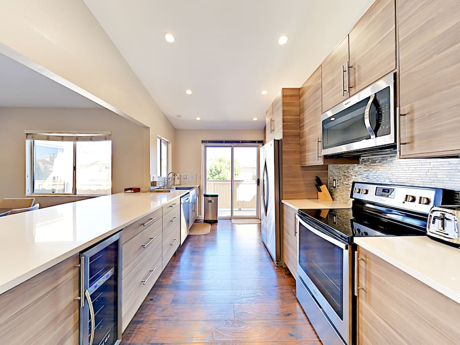 Modern appliances fill the modern galley-style kitchen.