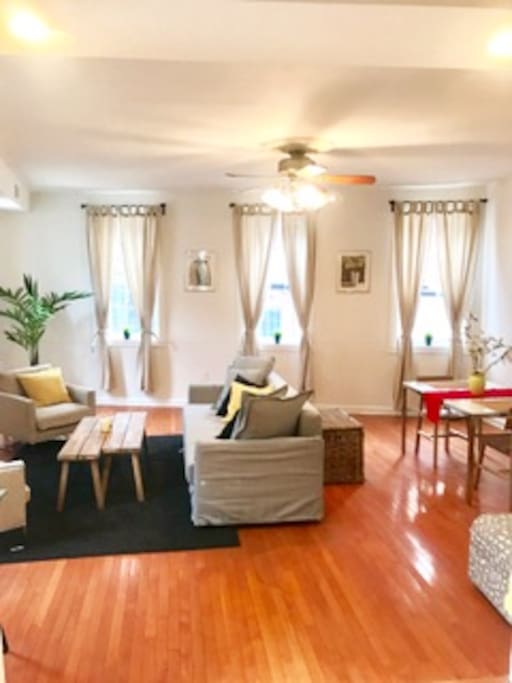 Large sunlit living and dining area
