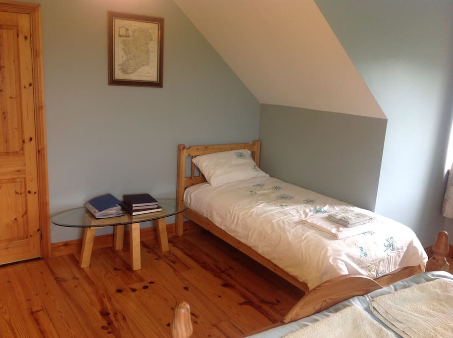 Single bed in large room