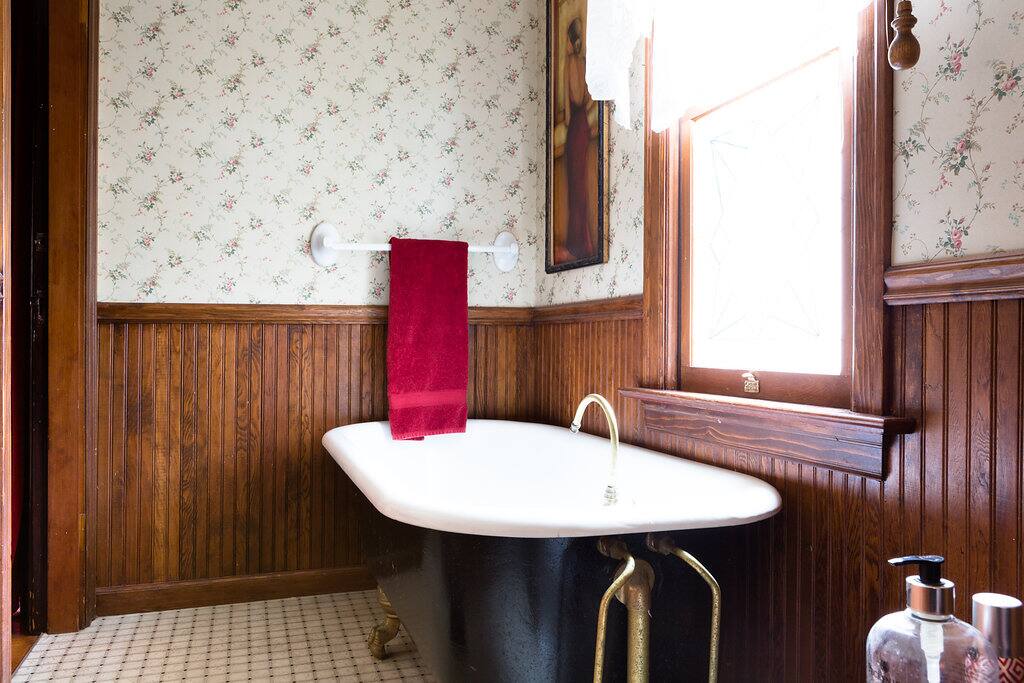 The bath just outside the Den hosts a 100 yr old soaking tub that is original to the house that was built in 1894.