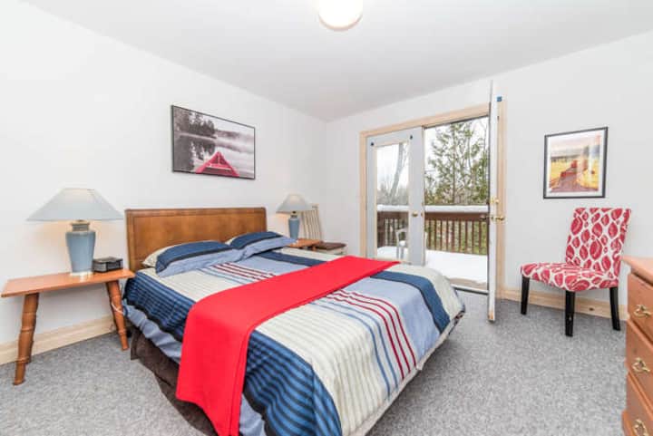 The third bedroom is the only one that offers a balcony overlooking  a wooded area.  This room is also equipped with a queen size bedroom.