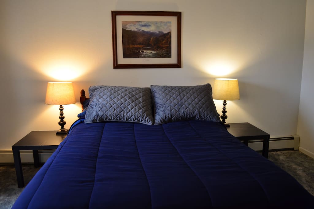 Double bed with fresh linens.