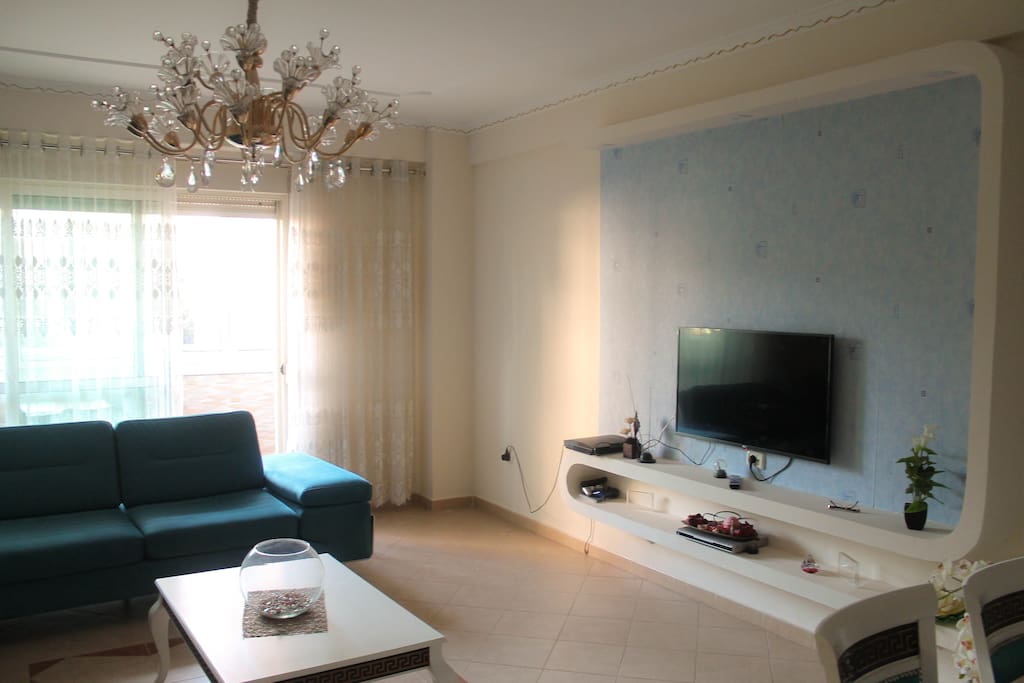living room with flat screen tv and playstation