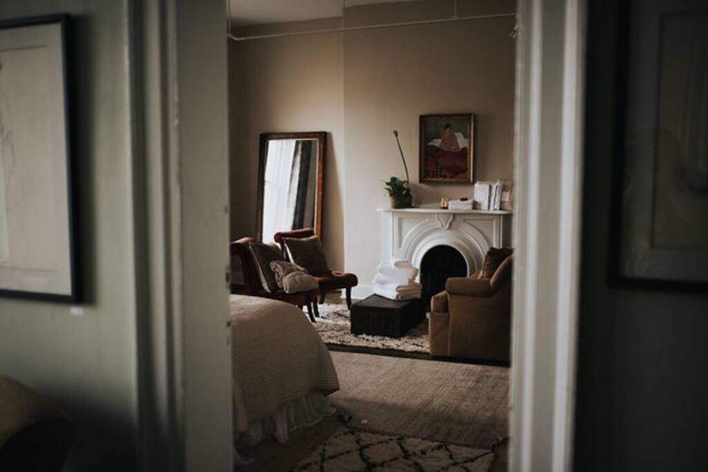 View from second floor common hallway into your room. New furnishings mixed with antique pieces.