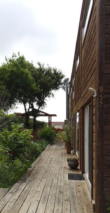 Front of house and deck. Deck available from both inside and outside the house.
Front wall almost entirely large windows that offer beautiful views of the lake.