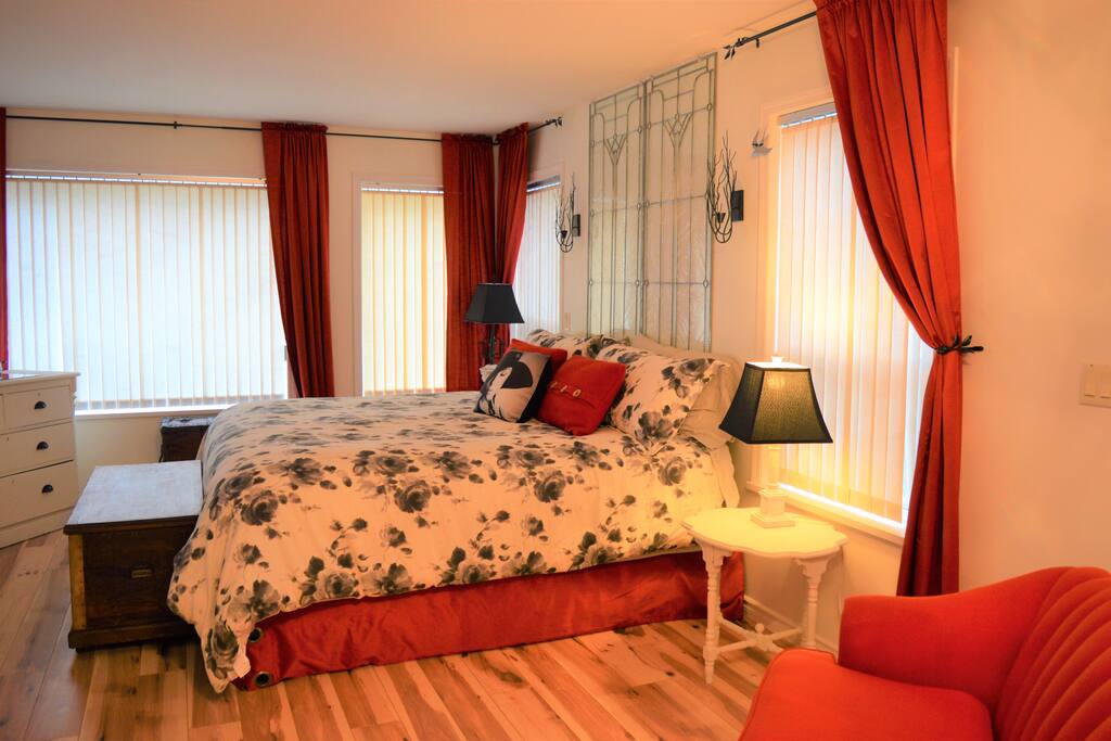 Garden Suite Master Bedroom with king size bed and exterior door.