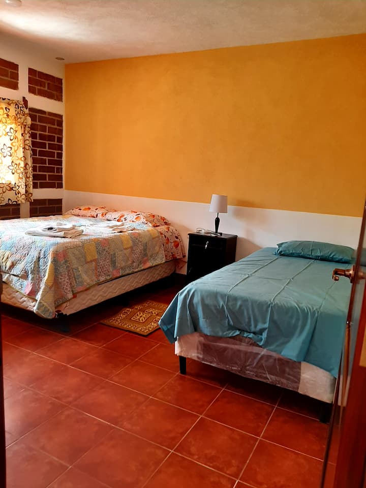 Room 2 with a double bed and a single