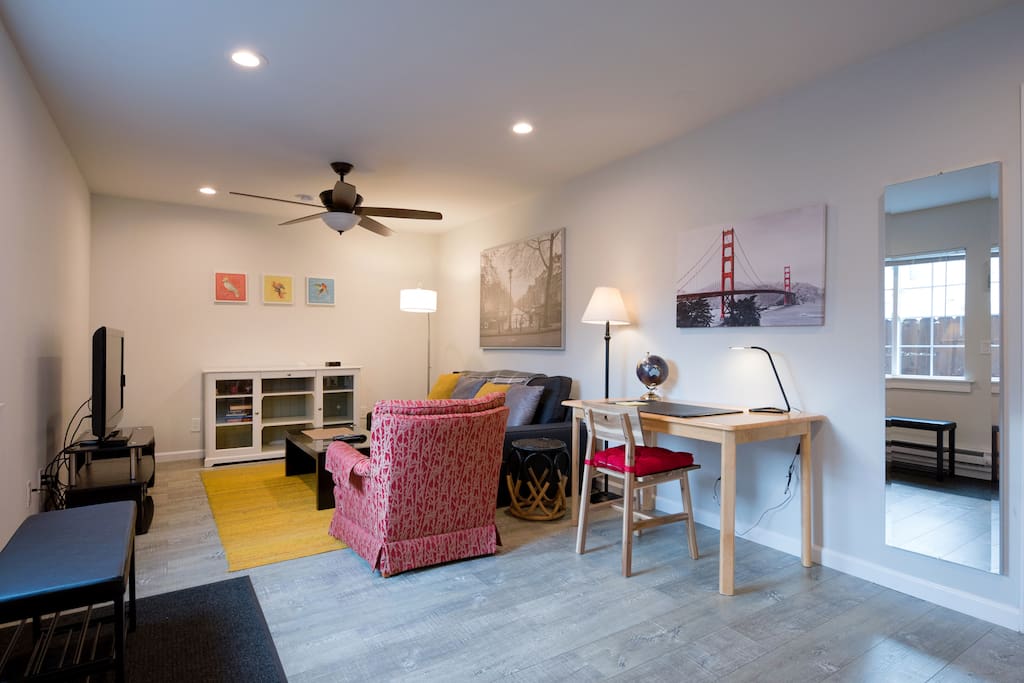 Living room with cable TV + roku and work desk