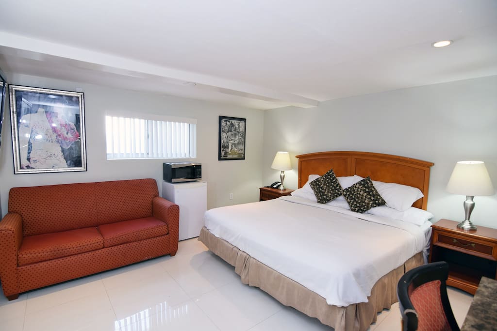 King size bed in a large suite hotel room