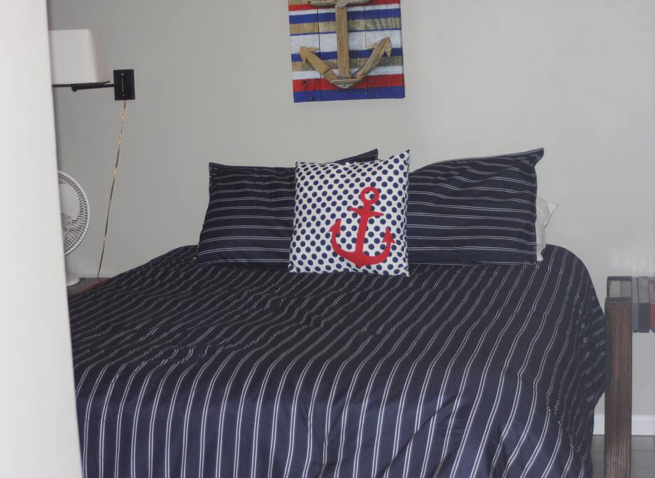 Basement bedroom with queen bed