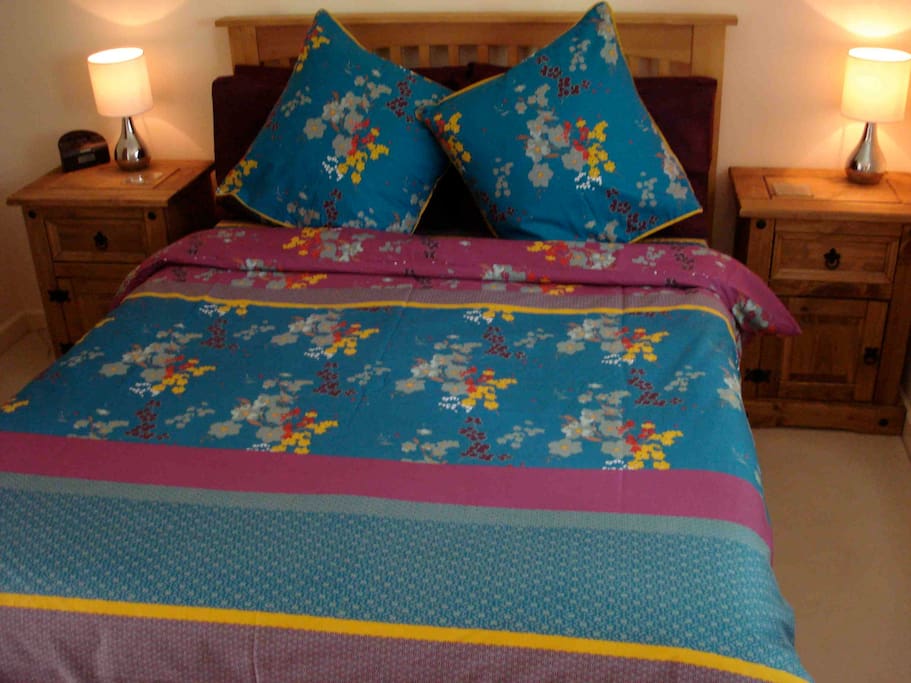 Separate cosy, peaceful bedroom with blackout blind, wardrobe, full length mirror, touch sensitive lamps, alarm/radio, hairdryer, original textile artwork