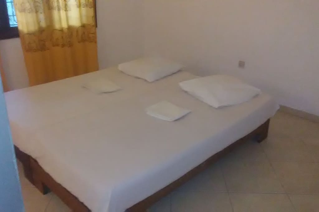 Spacious bed, clean and fresh. Our lovely host, upon your request, will help you wash your bedsheets and keep your room clean always. It's like staying in a 5 star hotel.