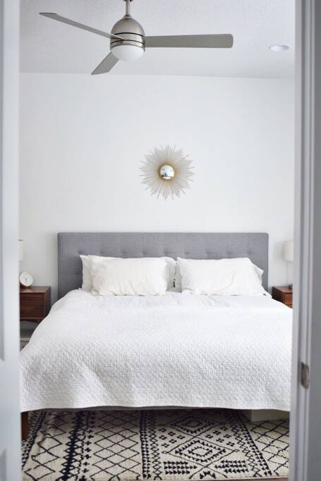 Modern king bed with plush mattress.