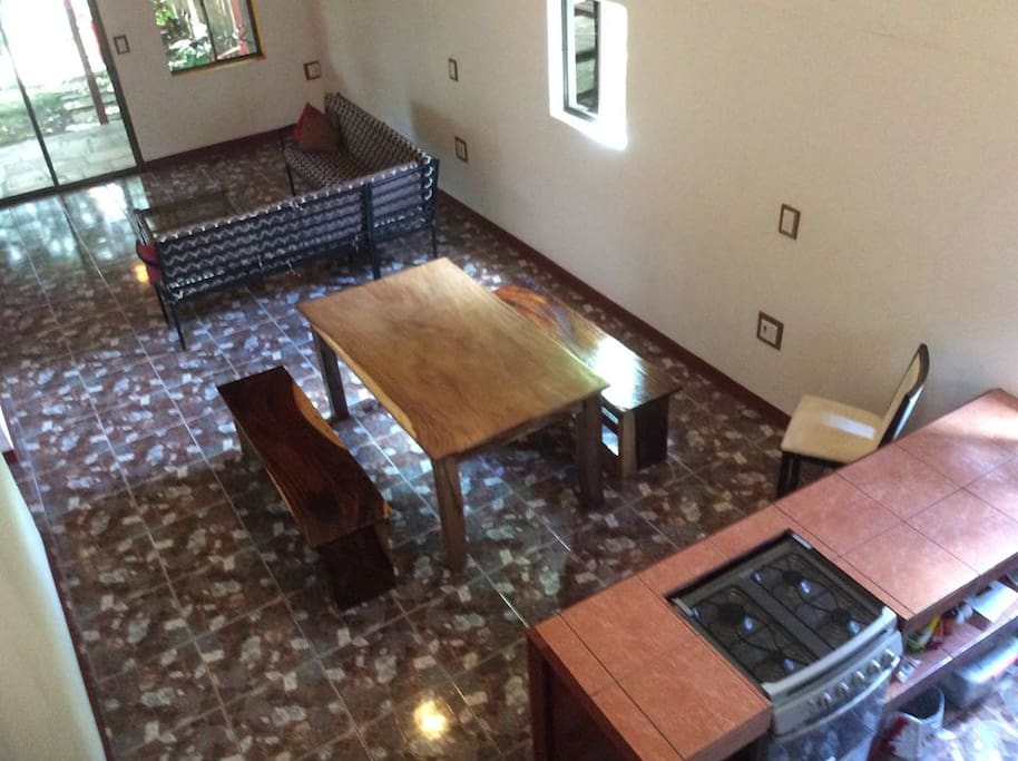 Open concept living space. Kitchen , microwave, oven, refrigerator, dining table and large couch. High ceilings to keep the casa comfortable. Totally private space for renter.