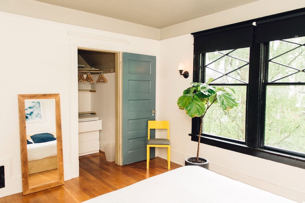 Empty closet with wood hangers and a dresser for your things.