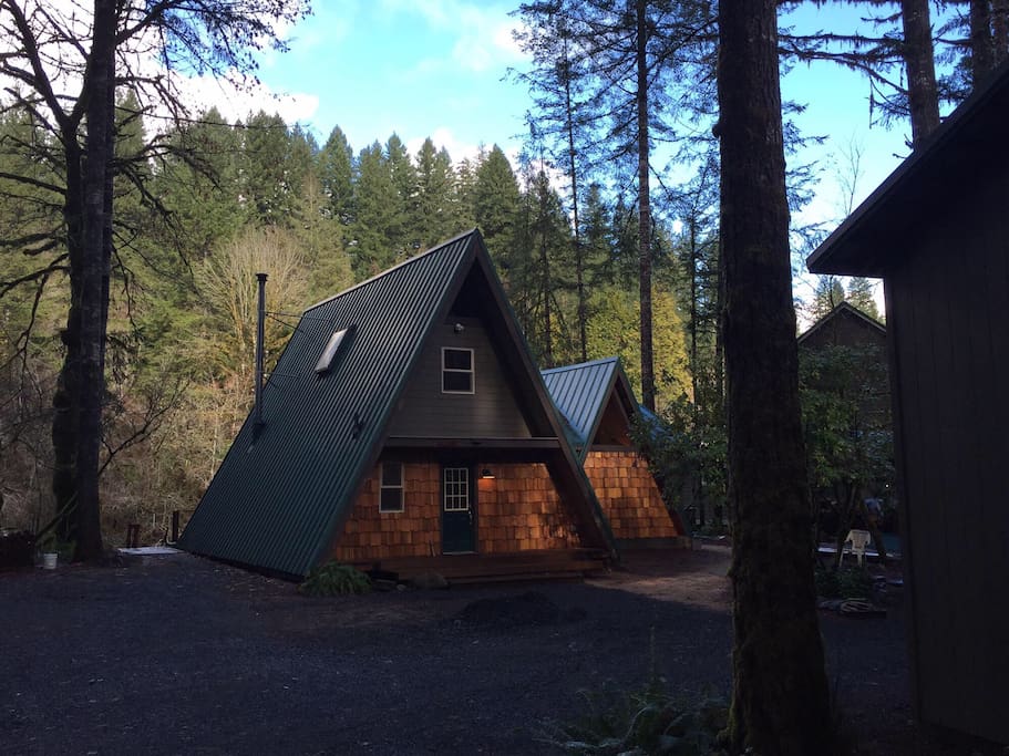 The newly renovated cabin is nestled in the trees on the bank of the Little North Fork of the Santiam River.