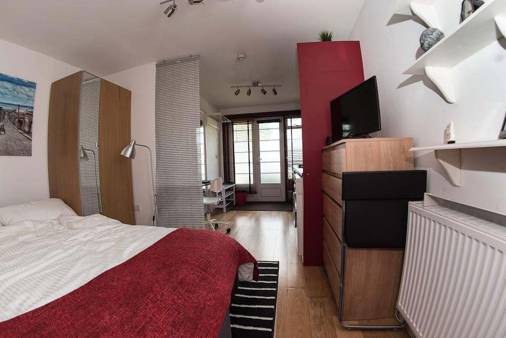 Living/Sleeping area: radiator, pullout double bed, chest of draws (stocked with extra set of bed linen), 24" Freeview TV, mirrored wardrobe (with safe deposit box)