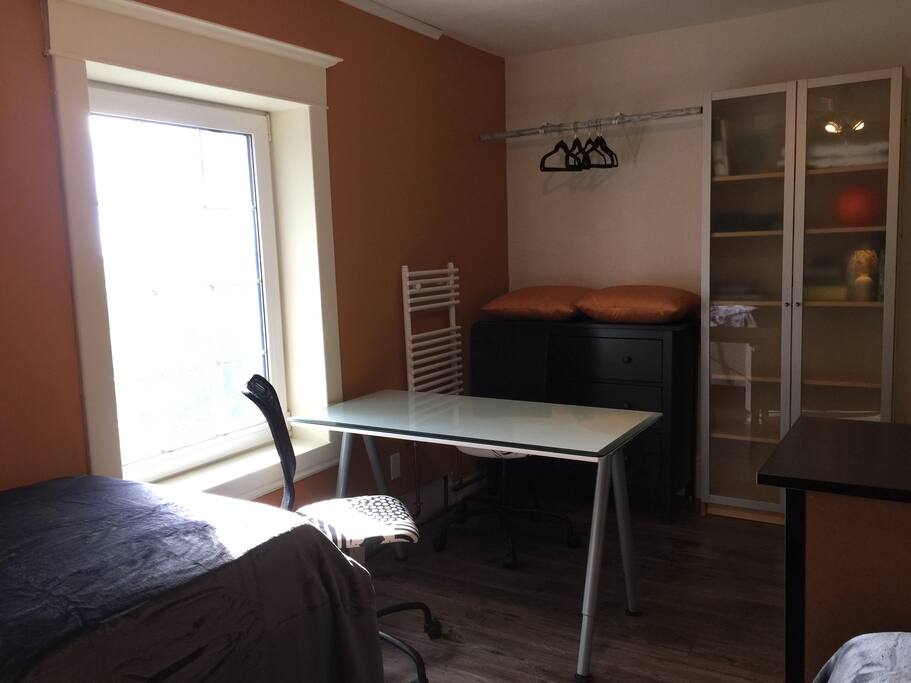Room also includes a table + 2 chairs