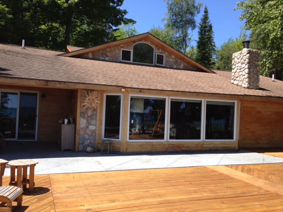 Beautiful stone work. Bay windows look out at lake.