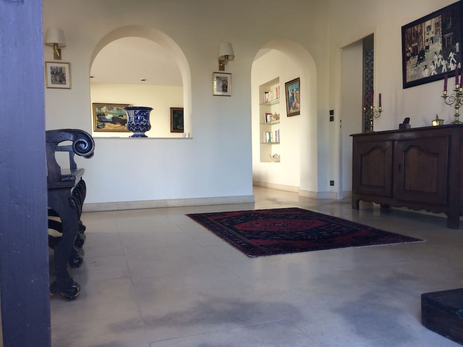 Entry leading to the living room in front and the kitchen on the right side