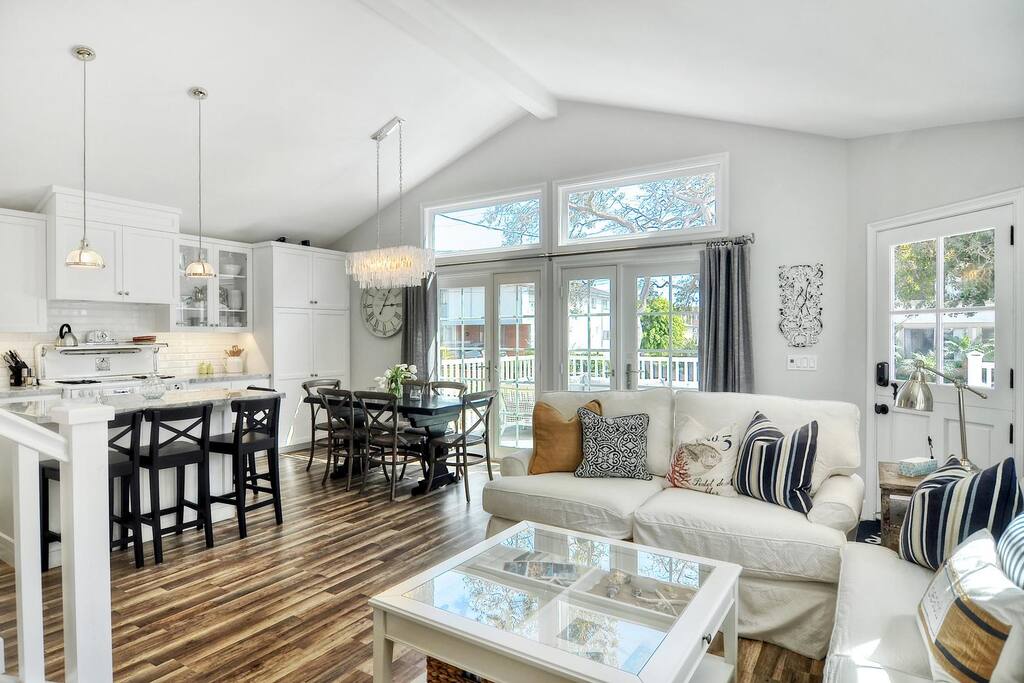 Great room at with living, dining, kitchen, and doors onto the deck.