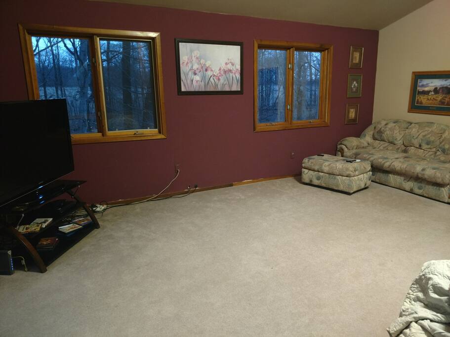 upstairs loft with couch and recliners