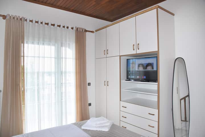 Master bedroom closet with plenty of hangers, safe and a smart full HD TV where you can stream from your IPAD with airplay