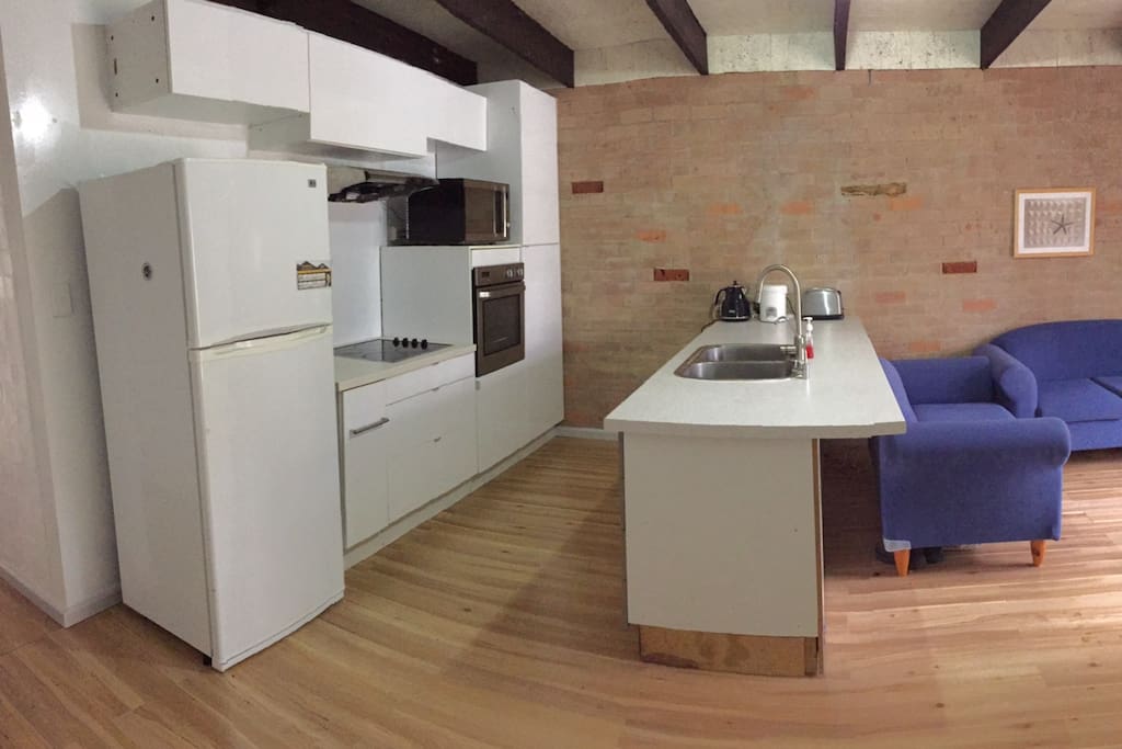 Fully functional modern kitchen with stainless steel appliances. You will have access to an electric stove top, oven, fridge, microwave, kettle and toaster. The island has bar stools to act as a breakfast bar. The dining area is next to the kitchen and opens up to a large deck for alfresco dining.