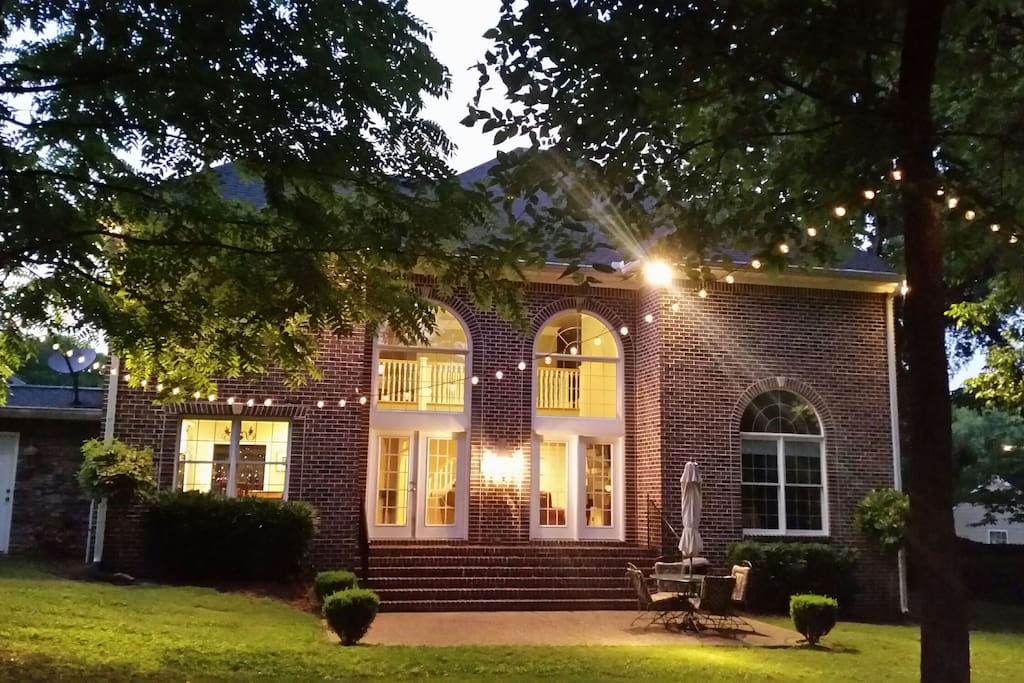 Photo of back of home getting dark.