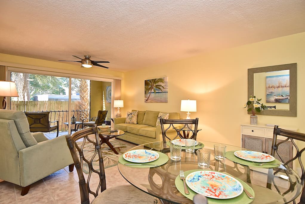 Open concept design with private screened-in lanai beyond sliding glass doors.