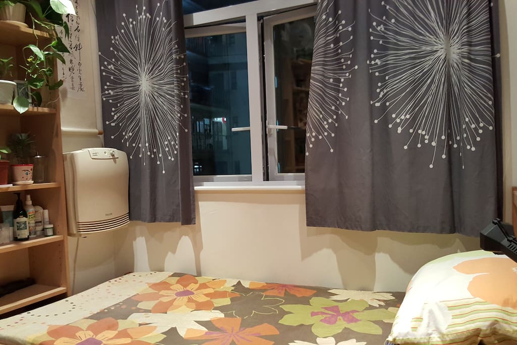 Bedroom with large window, shelving and cabinet space. Bed 120cm x 195cm, bit smaller than double.