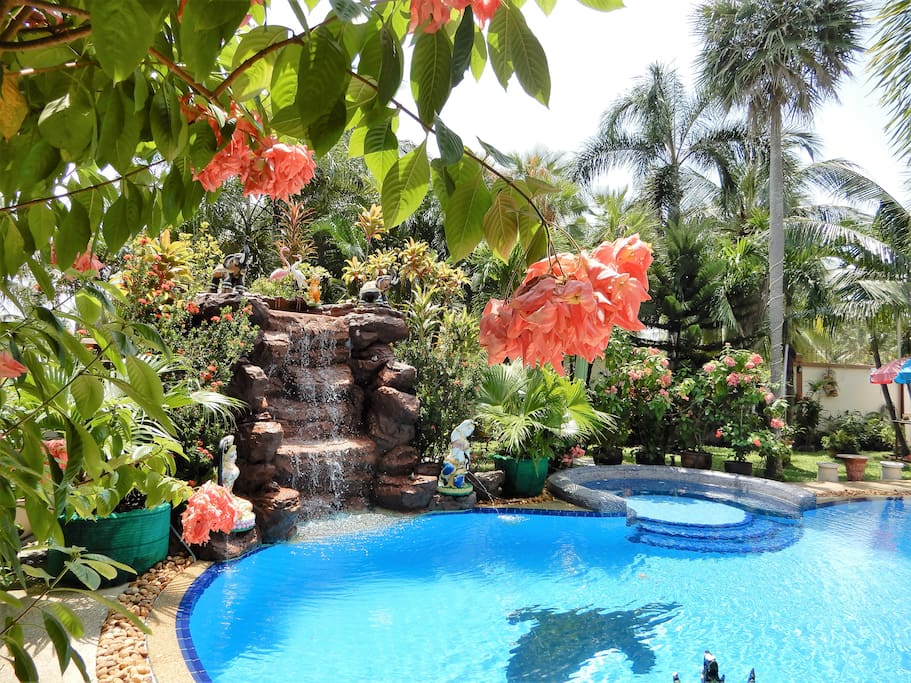 Stunning Tropical garden with a large swimming pool