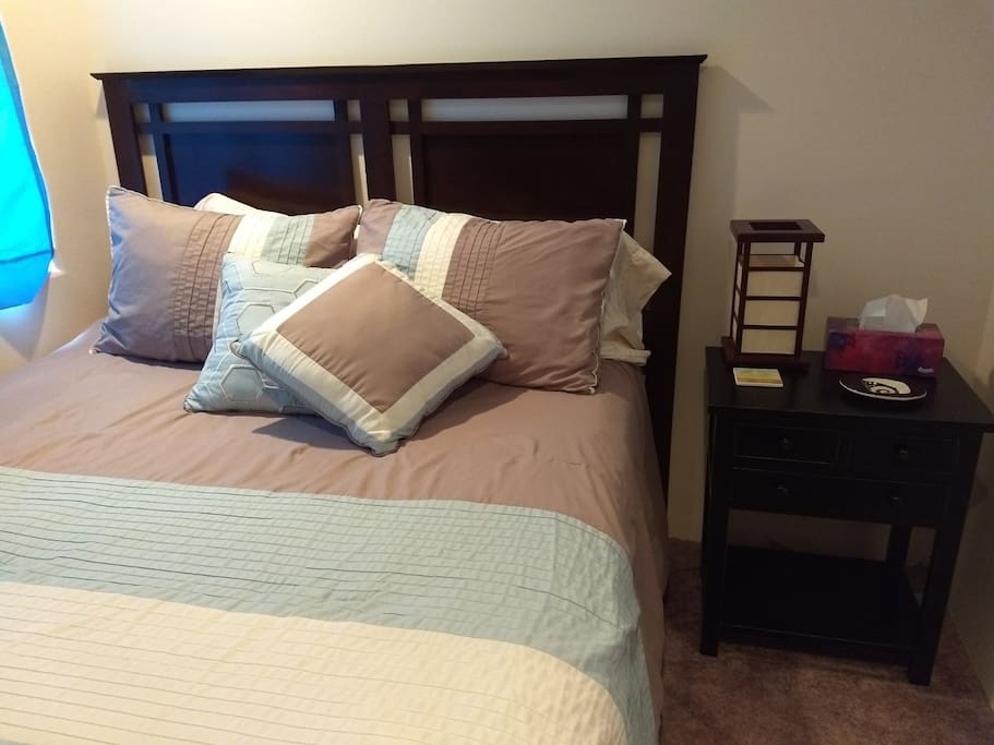 Queen bed with window, closet and night stand, sound machine with usb charger.