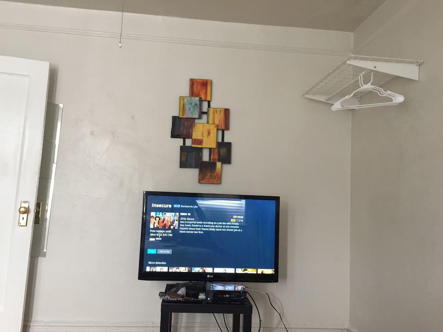 Cable Tv, shelf you can store stuff and hang clothing.
