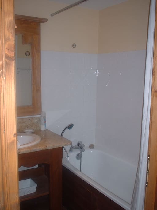 En suite bathroom, with bath, shower and toilet.