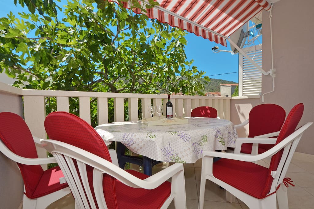table with chairs on the balcony,you can feel healing odor of the sea