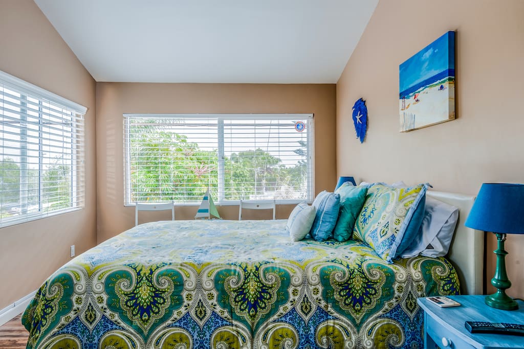 The Master Bedroom is filled with natural light and relaxing ocean views