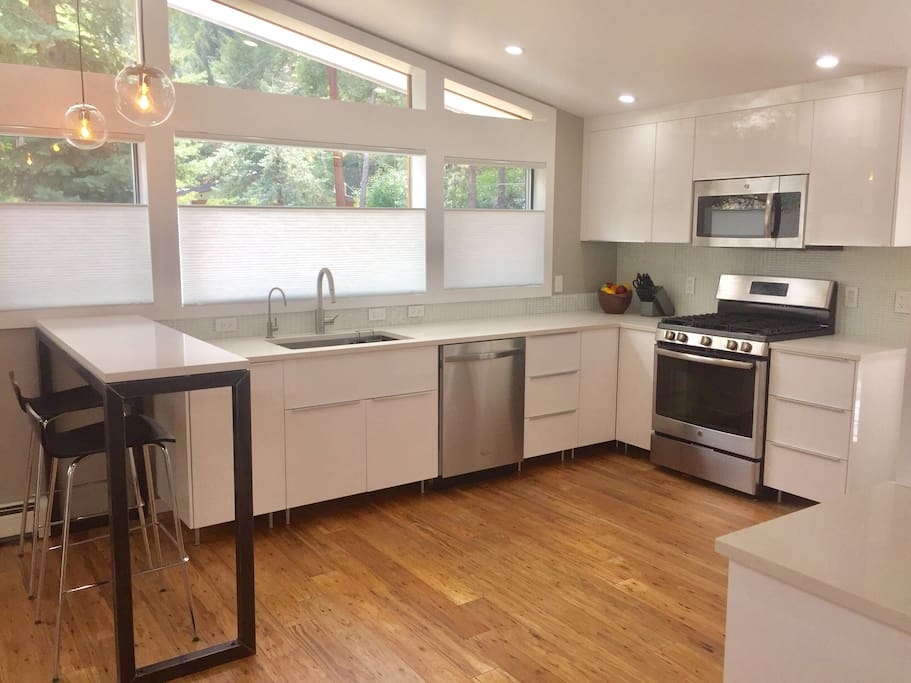 brand new kitchen with stainless appliances and quartz countertops, fully equipped for those who like to cook