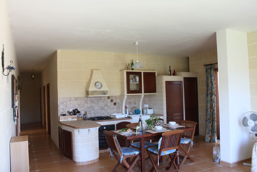 Kitchen includes box room, fridge/freezer electric oven, gas stove, sink, microwave, pots, pans, plates and all necessary cooking utensils etc..