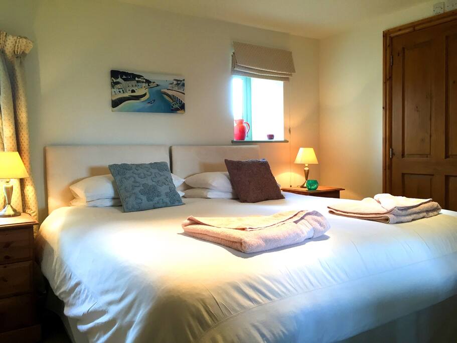 The downstairs bedroom has a super king bed that can be split into 2 full size singles. it has its own ensuite bathroom.