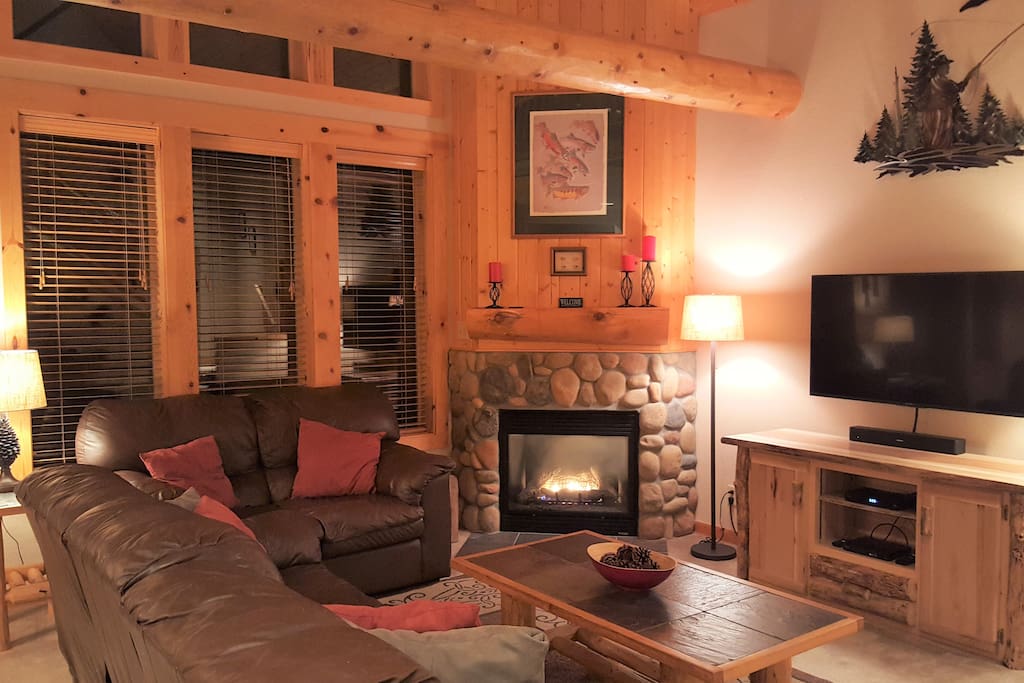 Living Room area with new 50" Flat Screen TV, Bose Sound Bar, DVD/ BlueRay, Entertainment Cabinet, Gas Fireplace & themed Artwork/Décor